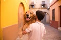 Dog on a man's shoulders. Concept pets, animals, dogs, pet love, golden retriever