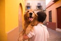 Dog on a man\'s shoulders. Concept pets, animals, dogs, pet love, golden retriever