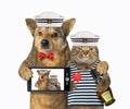 Dog with cat mariner makes selfie Royalty Free Stock Photo