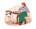 Dog owner and puppy in pet-friendly cafe. Woman eating in restaurant with cute doggy at table. Female character and