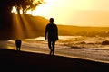 Dog and owner on sunset beach Royalty Free Stock Photo