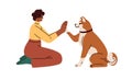 Dog owner training cute smart doggy to give high five, paw clapping hand. Human and obedient pet animal communication