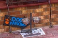 Dog parking area with a drinking bowl in front of the store door Royalty Free Stock Photo