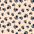 Dog paw print vector seamless pattern. Royalty Free Stock Photo