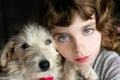 Dog pet and girl portrait blue eyes Royalty Free Stock Photo