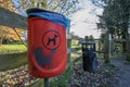 Dog poo waste litter bin. Trash can by park entrance.