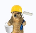 Dog with roller brush and tin of paint Royalty Free Stock Photo