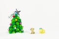 Dog and sheep looking Christmas tree isolated on white background Royalty Free Stock Photo