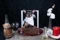 Dog sits at a served table, eating. The concept of food for dogs, good, quality animal nutrition .Funny picture of the dog eating