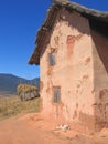 Dog sleeping along a house