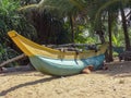 The boat at the the wild beach in Kalutara, Sri Lanka