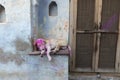 Dog sleeping outside house near nandgaon temple during Holi Festival,UttarPradesh,India