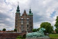 Dog statue and the facade of the Rosenborg castle in Copenhagen, Denmark.