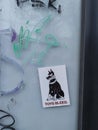 Dog sticker & x22;toys bleed& x22; found on abandoned store window