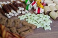 Dog tasty colored biscuits on wooden background Royalty Free Stock Photo