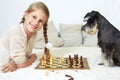 The dog teaches the child to play chess. Your move Royalty Free Stock Photo