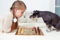 The dog teaches the child to play chess. Your turn Royalty Free Stock Photo