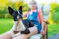 Dog and teenage girl resting in the garden Royalty Free Stock Photo