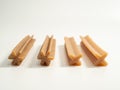 Dog teeth cleaning sticks. Puppy toothpick to reduce tartar formation on a white background.