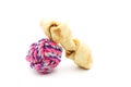 Dog toys, bait and ball of string to chew on, on a white background