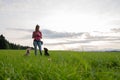 Dog trainer training obedience with her two dogs Royalty Free Stock Photo