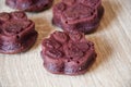 dog treat. pastry food for cat. appetizing dog muffins on wooden background. dog birthday. red velvet. paw shaped dog treat.