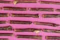 Dog treat sticks on a pink background. Dried beef esophagus.