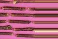 Dog treat sticks on a pink background