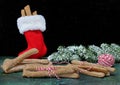 Dog treats being wrapped and put in a red fluffy stocking for Christmas Royalty Free Stock Photo