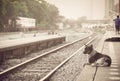 dog waiting for his master to the retro steam train station Royalty Free Stock Photo