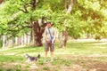 Dog walker enjoying with dogs while walking outdoors Royalty Free Stock Photo