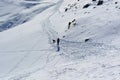 The dog and the woman on the trail high in the mountains