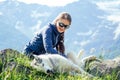 Dog with a woman walking mountains outdoors Royalty Free Stock Photo