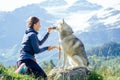 Dog with a woman walking mountains outdoors Royalty Free Stock Photo