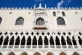 Doge Palace building with lion statue and white architecture in Venice