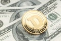 Dogecoin coin on dollar banknotes