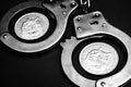 Dogecoins and handcuffs Royalty Free Stock Photo