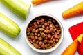 Dogfood, carrot and courgette on table background top view Royalty Free Stock Photo