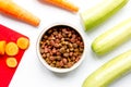 Dogfood, carrot and courgette on table background top view Royalty Free Stock Photo