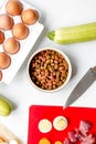 Dogfood, eggs, meat, carrot and courgette on table background top view Royalty Free Stock Photo