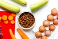 Dogfood set with vegetables, eggs and meat on table background top view Royalty Free Stock Photo