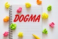 Dogma word written on notebook