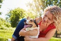 Dogs deserve your undivided attention. a young woman bonding with her dog in the park. Royalty Free Stock Photo