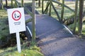 Dogs must be kept on a lead or leash in public park play area sign on entrance gate Royalty Free Stock Photo