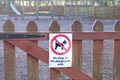 Dogs must be kept on a lead or leash in public park play area sign on entrance gate Royalty Free Stock Photo