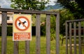 Dogs prohibited sign at the entrance gate to a playground Royalty Free Stock Photo