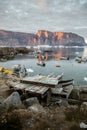 Dogsleds in Uummannaq shore, North Greenland. During Arctic Sunset.