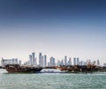 Doha city urban skyline view and dhow boat in qatar