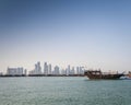 Doha city urban skyline view and dhow boat in qatar Royalty Free Stock Photo