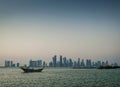 Doha city urban skyline view and dhow boat in qatar